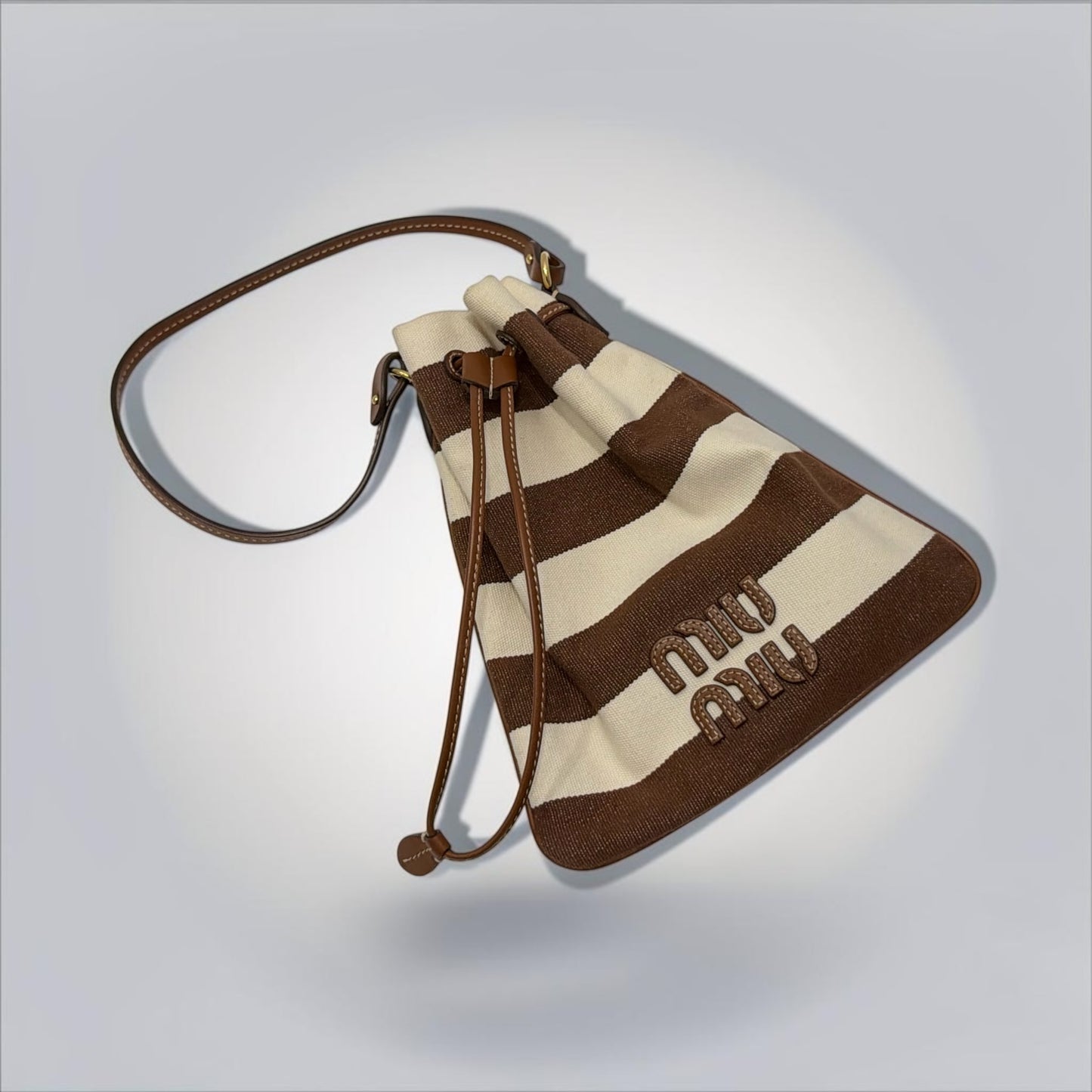 Pre-Owned Miu Miu Brown Cream Striped Canvas Bucket Bag Leather Logo Drawstring — Very Good | Style Reissue Vancouver