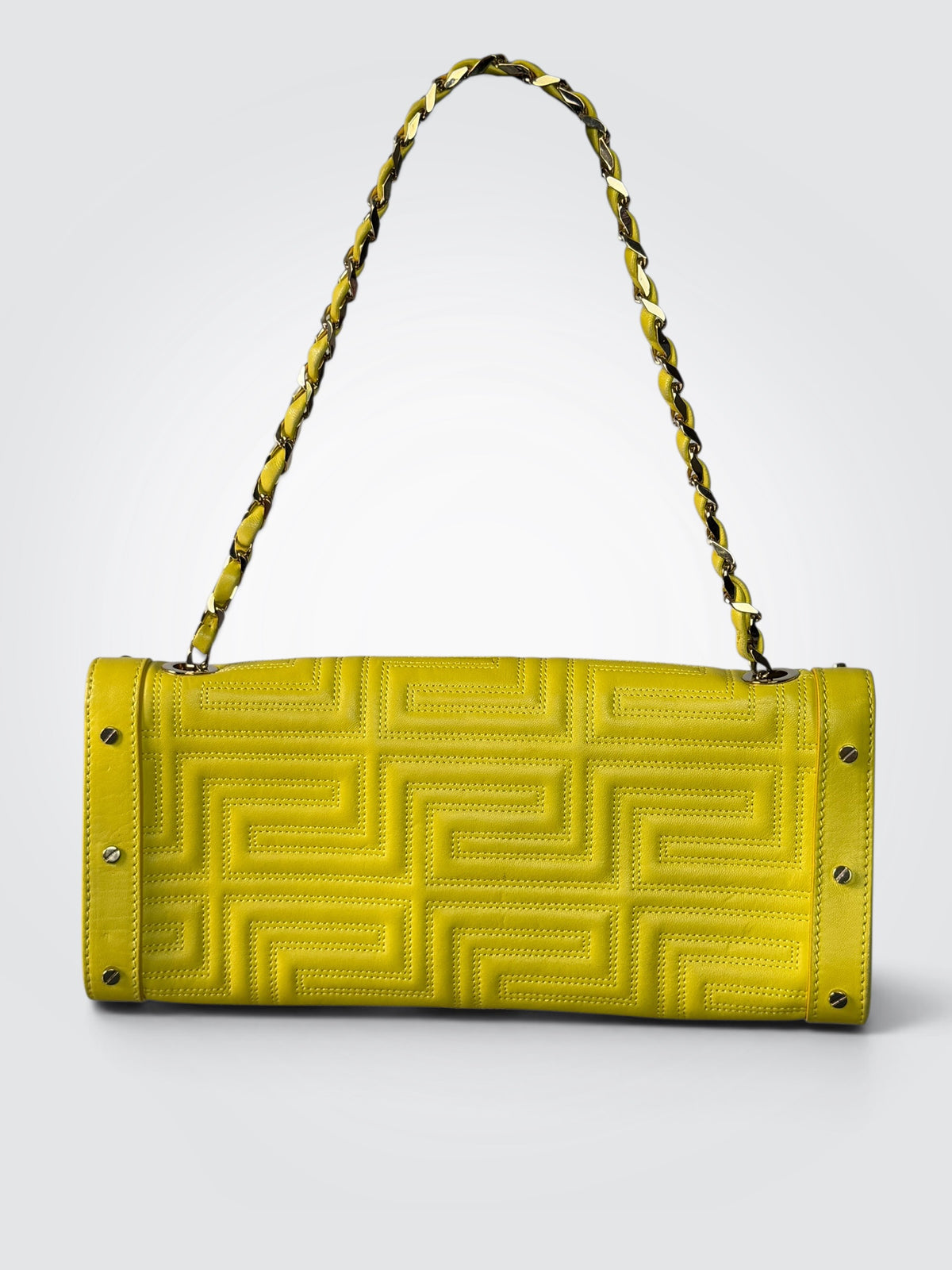 vintage Gianni Versace yellow quilted leather shoulder bag featuring a geometric Greek-key motif and a braided chain strap.