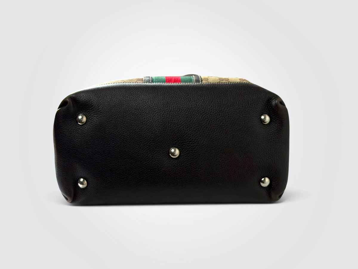 vintage Gucci GG canvas medium Sunset tote featuring dark brown leather trim and the signature green and red Web stripe.