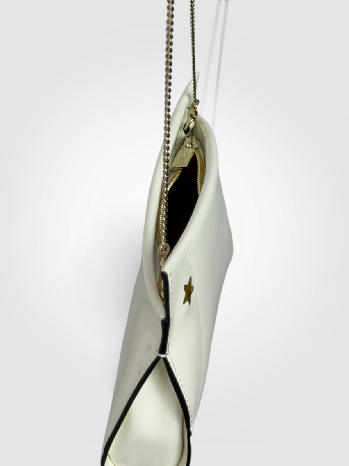 Christian Louboutin white patent leather Loubitwist small clutch with a detachable chain strap and signature star detail.