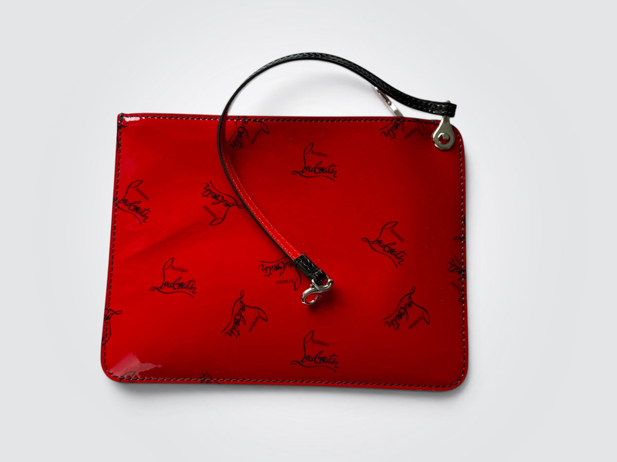 Christian Louboutin Cabata red and black gradient patent leather small tote featuring signature silver-tone spike detailing on the handle attachments.