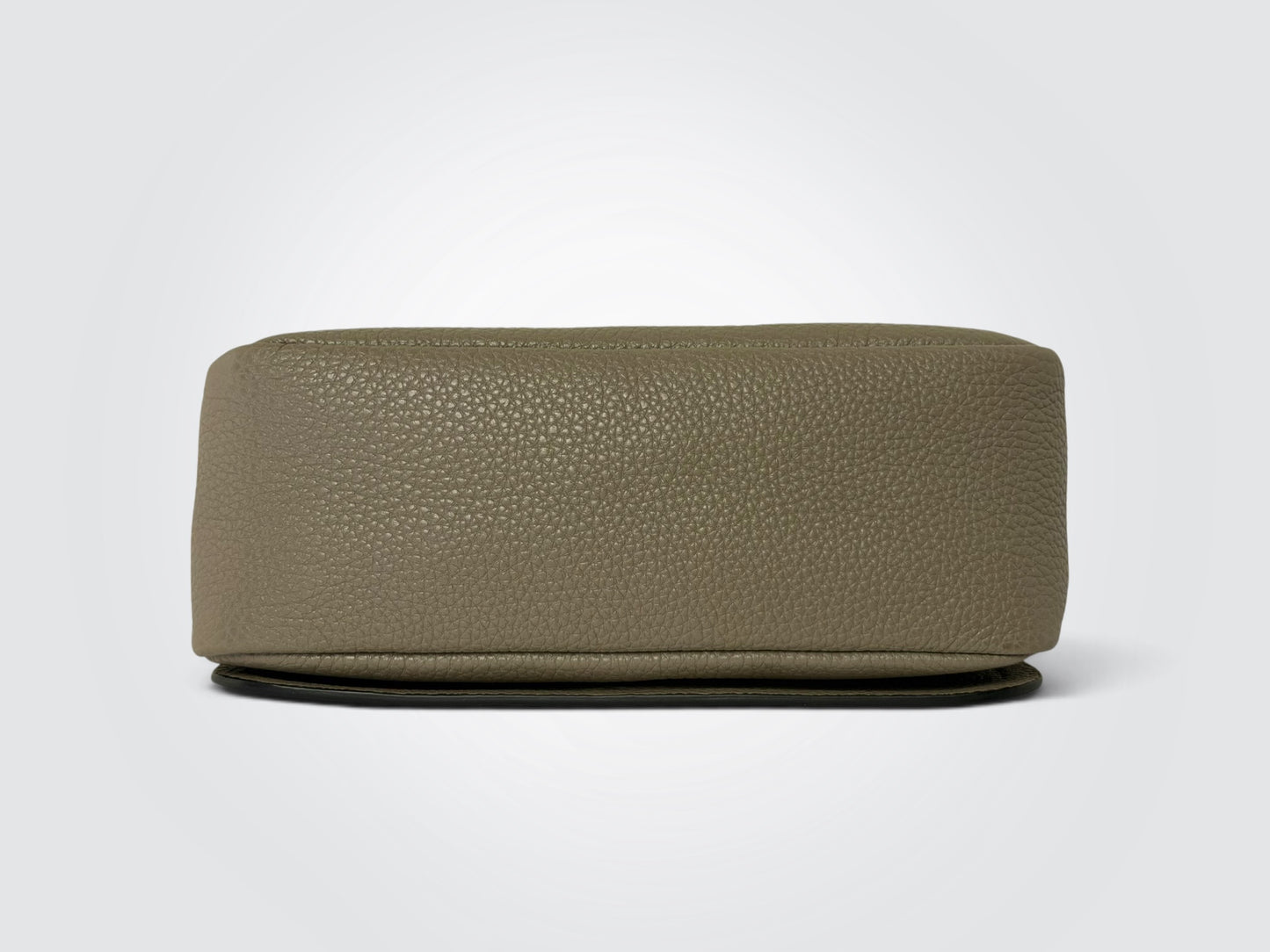 Prada Vitello Daino Soft Flap Crossbody in the argilla (clay grey) colorway, featuring textured calfskin leather and a logo-print embroidered woven strap