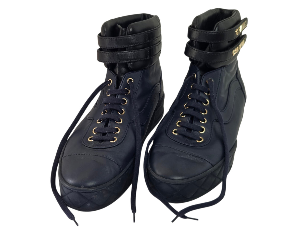 Pre-Owned Chanel Black Leather High-Top Sneakers with Gold Logo — Size 41