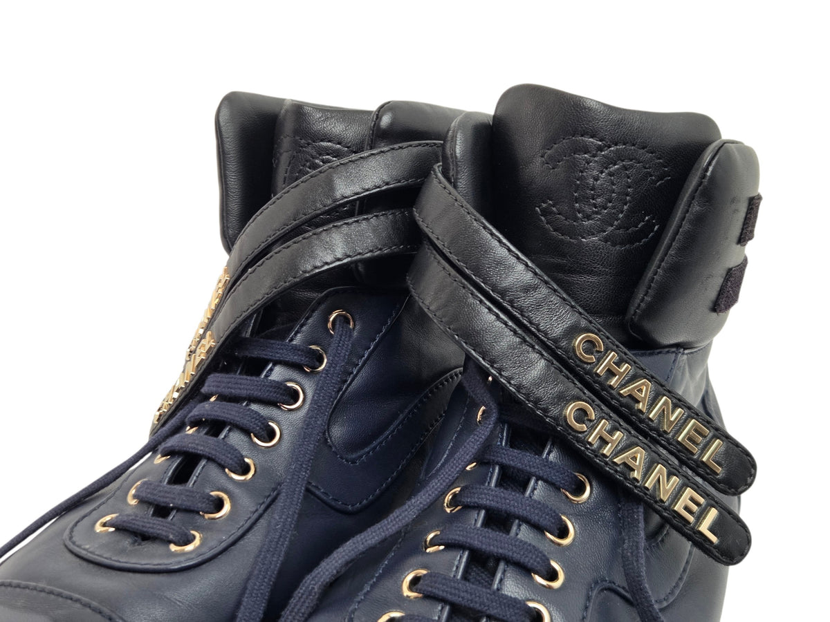 Pre-Owned Chanel Black Leather High-Top Sneakers with Gold Logo — Size 41