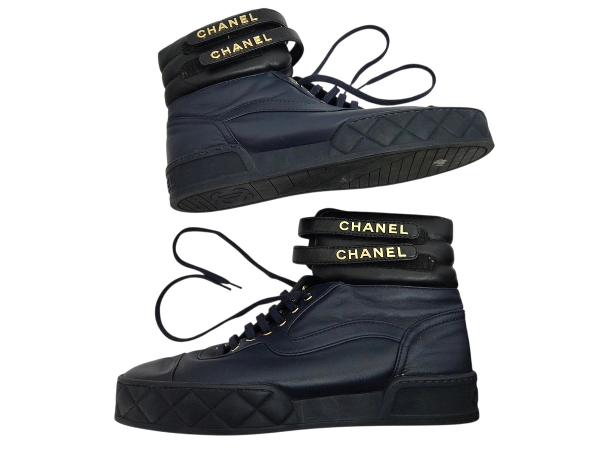 Pre-Owned Chanel Black Leather High-Top Sneakers with Gold Logo — Size 41