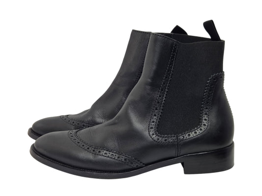 Pre-owned Balenciaga black leather wingtip brogue Chelsea boots with elastic side panels and low block heel, size 38.5 — available at Style Reissue Vancouver