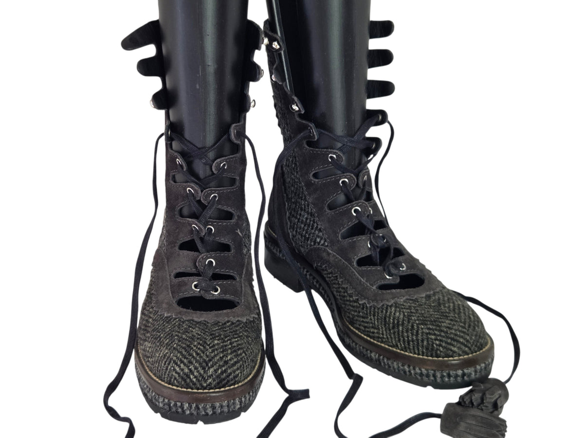 Pre-owned Chanel grey herringbone tweed lace-up combat boots with CC logo hardware and tassel laces, size 41 — available at Style Reissue Vancouver