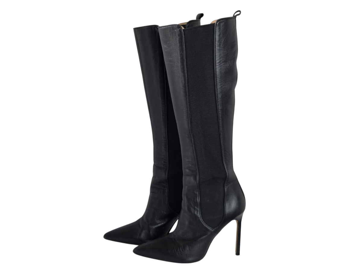 Pre-owned Manolo Blahnik black leather knee-high stiletto boots with pointed toe and side zip, size 36 — available at Style Reissue Vancouver
