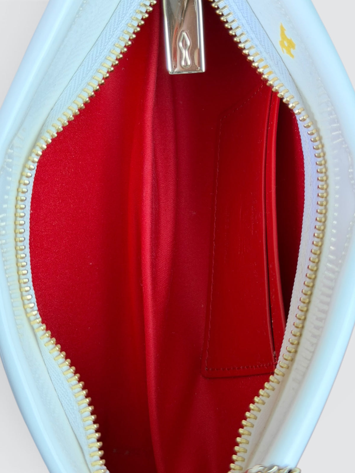 Christian Louboutin white patent leather Loubitwist small clutch with a detachable chain strap and signature star detail.