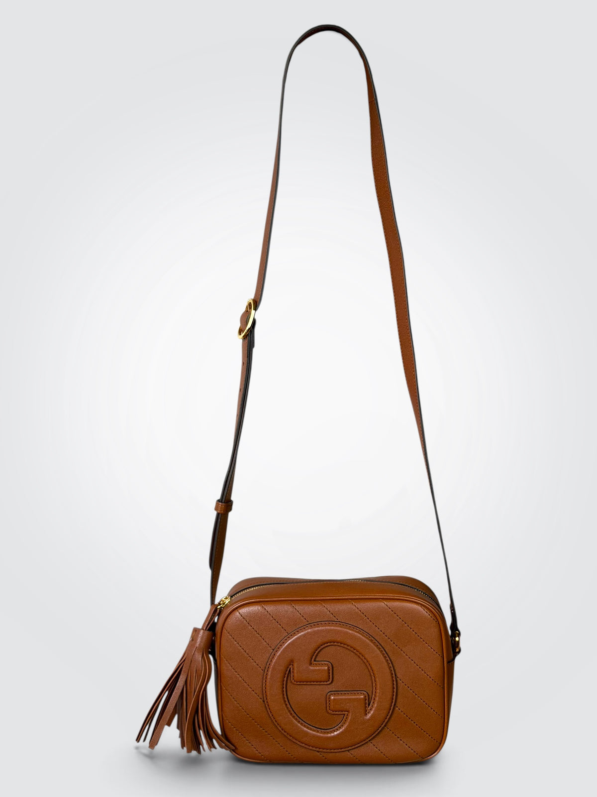 Pre-owned Gucci Blondie Small shoulder bag in brown leather with prominent Interlocking G logo and matching side tassel detail