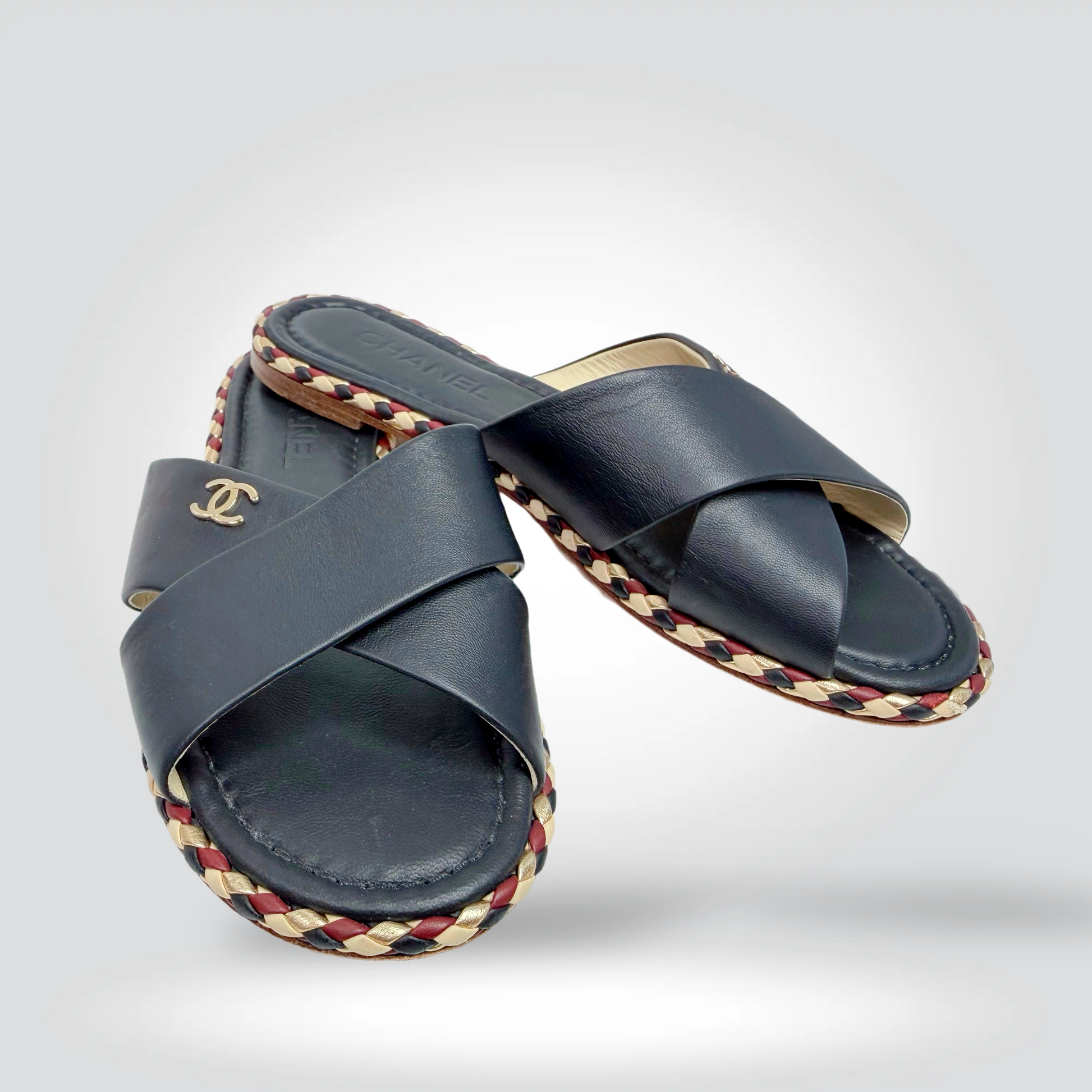 Pre-Owned Chanel crossed strap slide sandals navy blue leather CC logo braided sole trim — Style Reissue Vancouver
