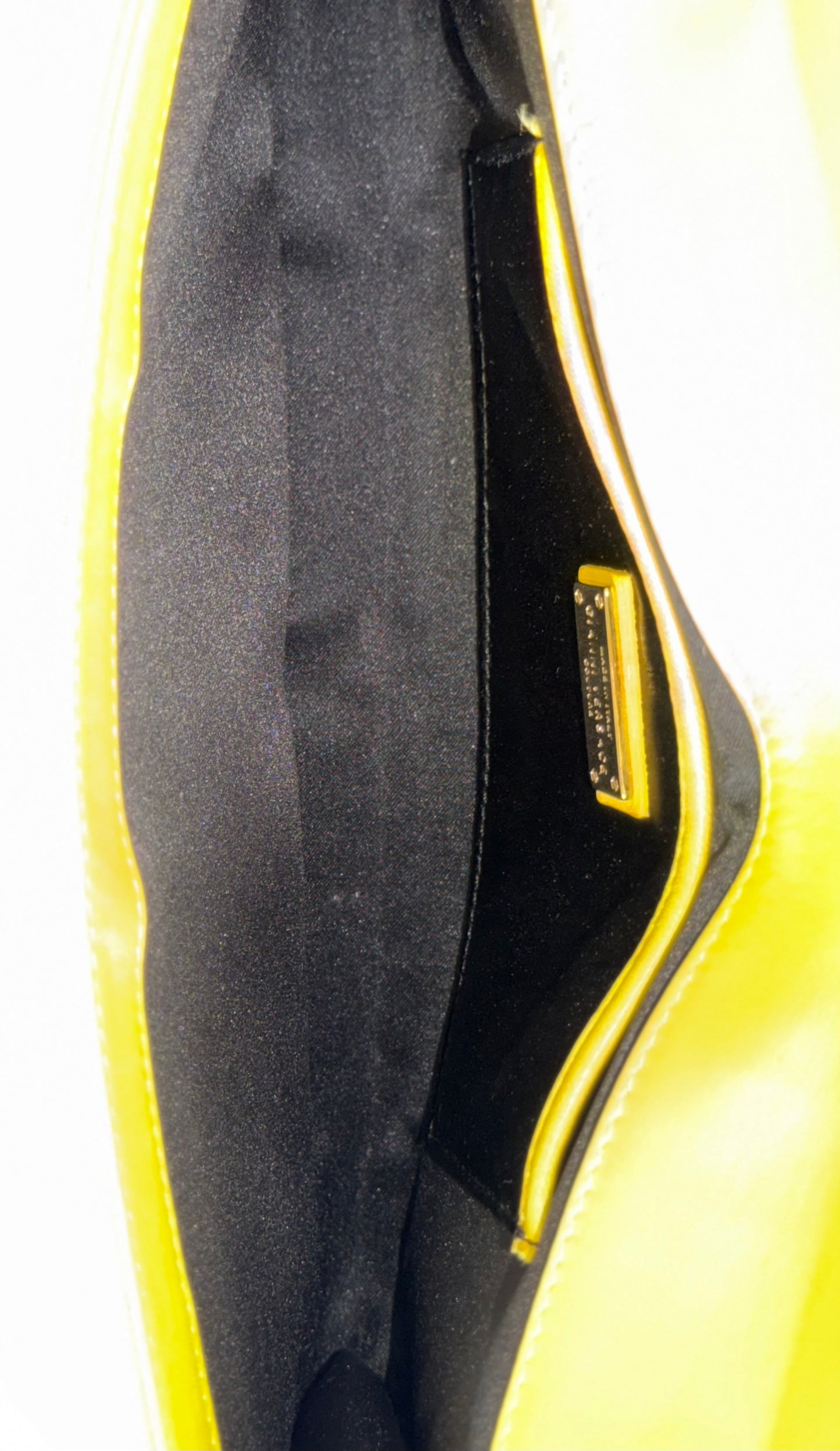 vintage Gianni Versace yellow quilted leather shoulder bag featuring a geometric Greek-key motif and a braided chain strap.