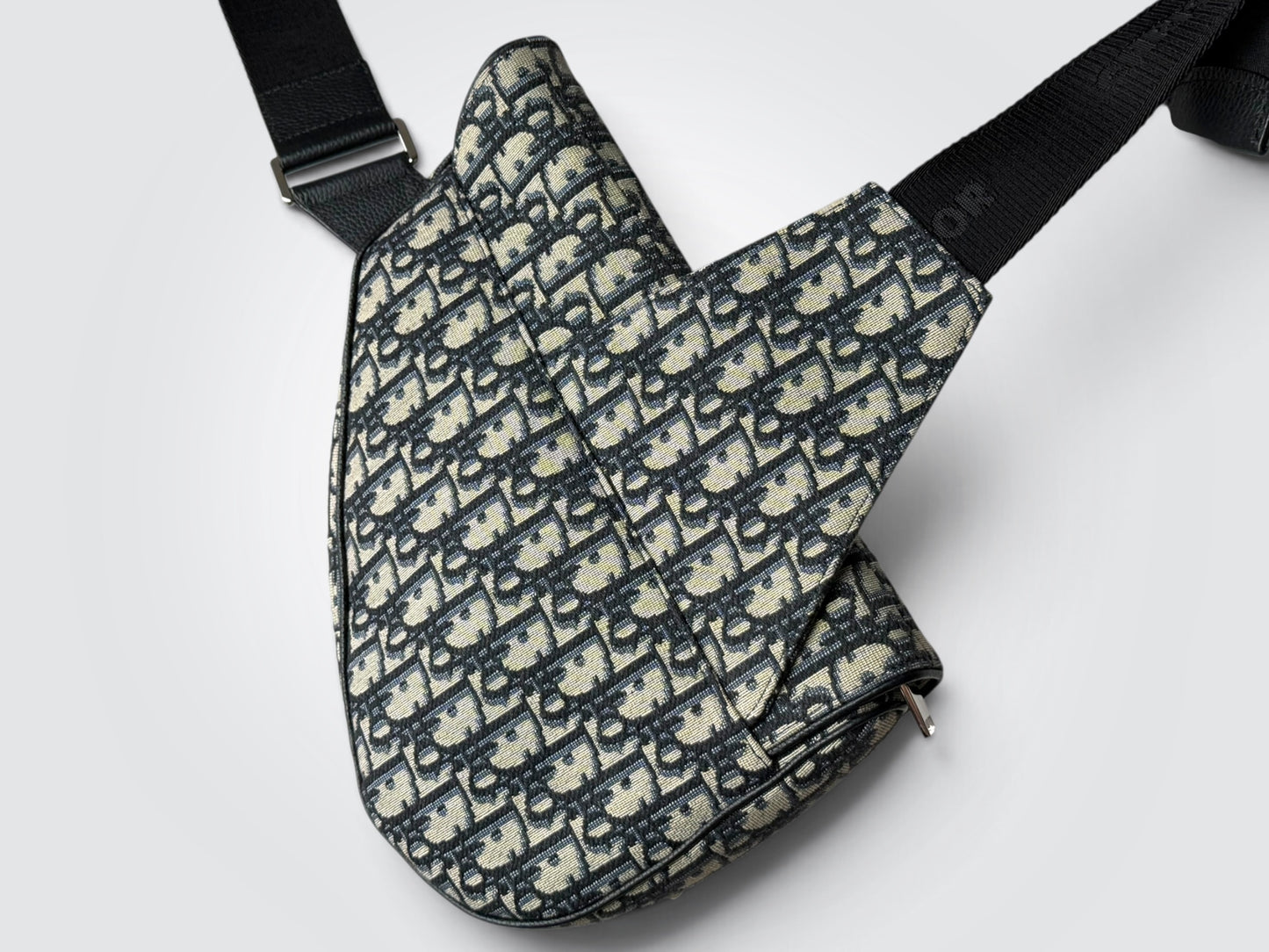 Pre-Owned Christian Dior Men’s Saddle Bag – Cream and Black Dior Oblique Jacquard Canvas with Adjustable Black Strap