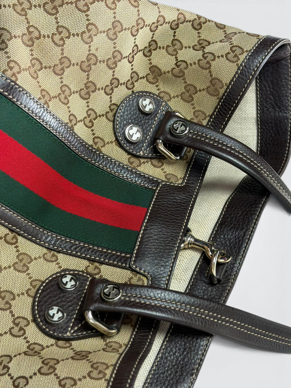 vintage Gucci GG canvas medium Sunset tote featuring dark brown leather trim and the signature green and red Web stripe.