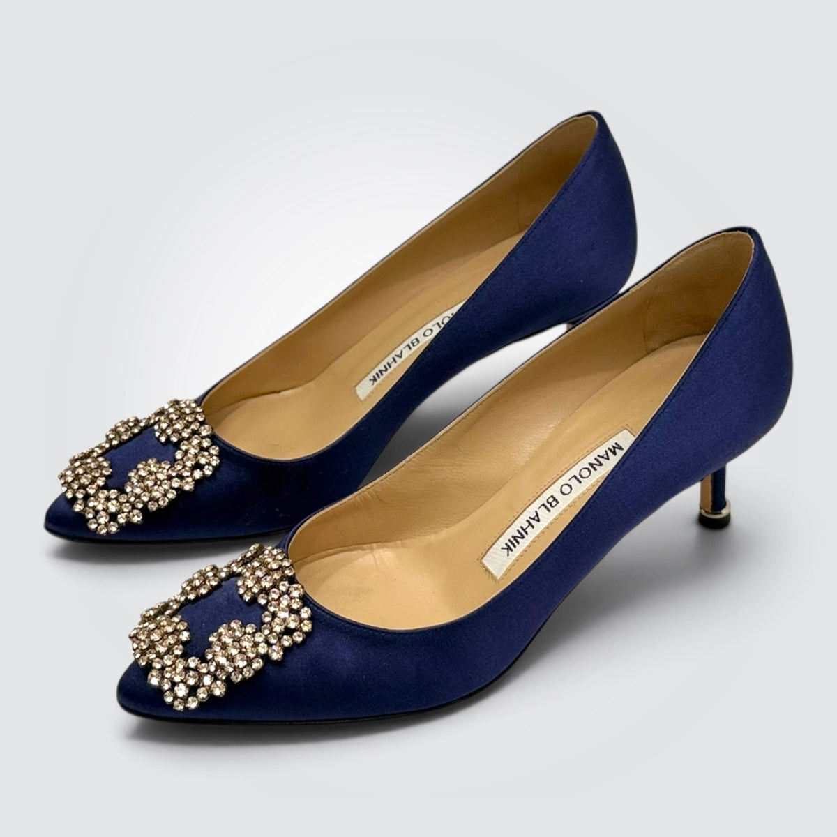 Pre-owned Manolo Blahnik Hangisi navy satin pumps with crystal buckle
