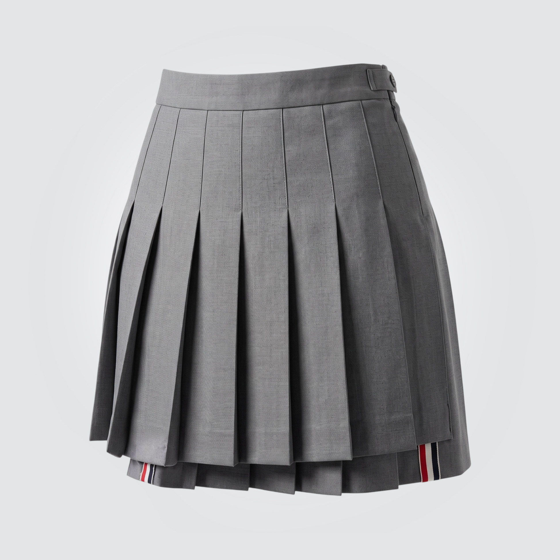 Pre-owned Thom Browne grey pleated skirt with signature red white blue grosgrain trim and side button closure
