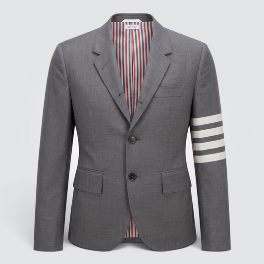 Pre-owned Thom Browne grey 100% wool single-breasted blazer with signature 4-bar stripe on left sleeve and RWB striped lining, size 7 / IT 42 — available at Style Reissue Vancouver