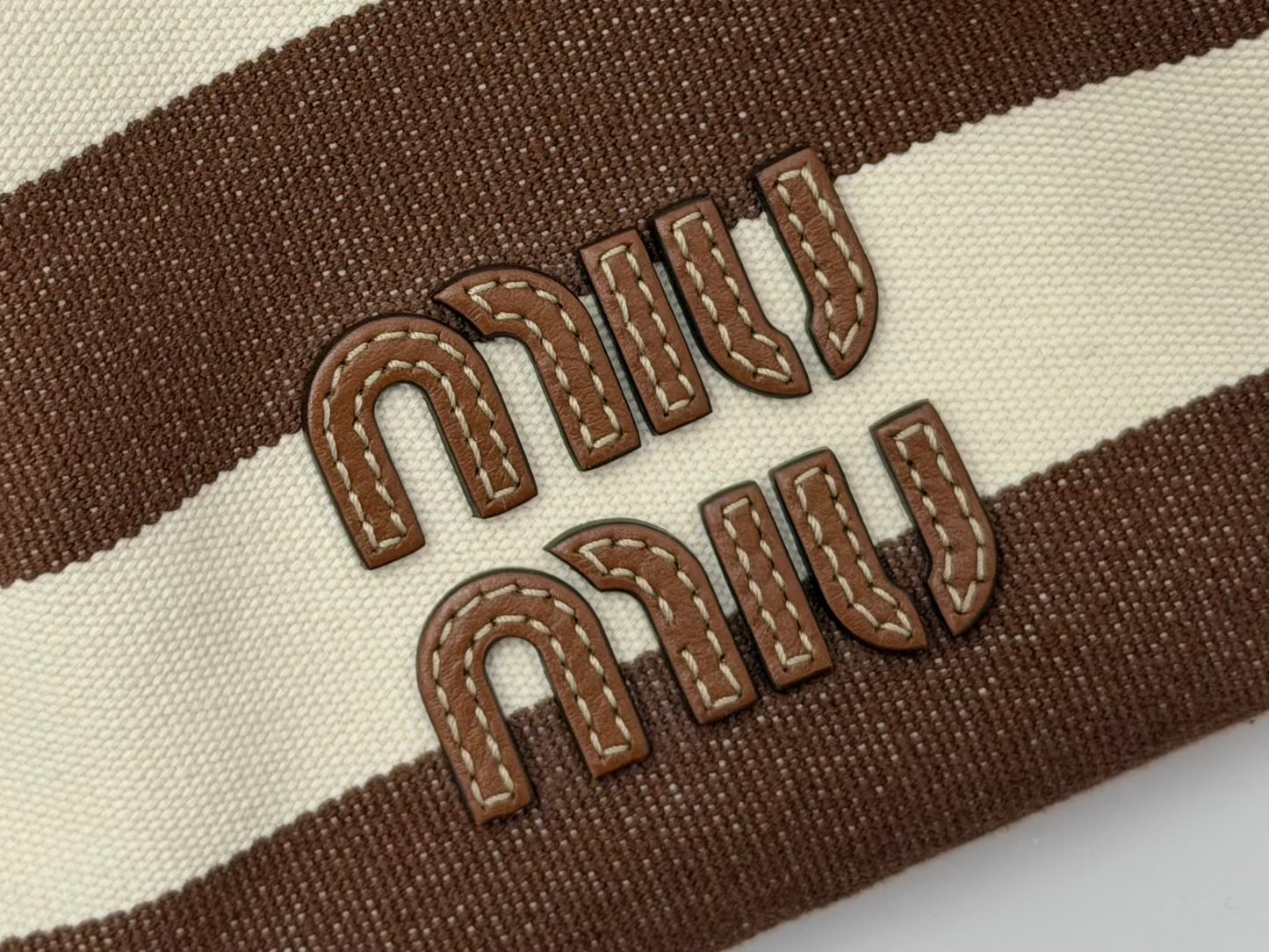 Pre-Owned Miu Miu Brown Cream Striped Canvas Bucket Bag Leather Logo Drawstring — Very Good | Style Reissue Vancouver