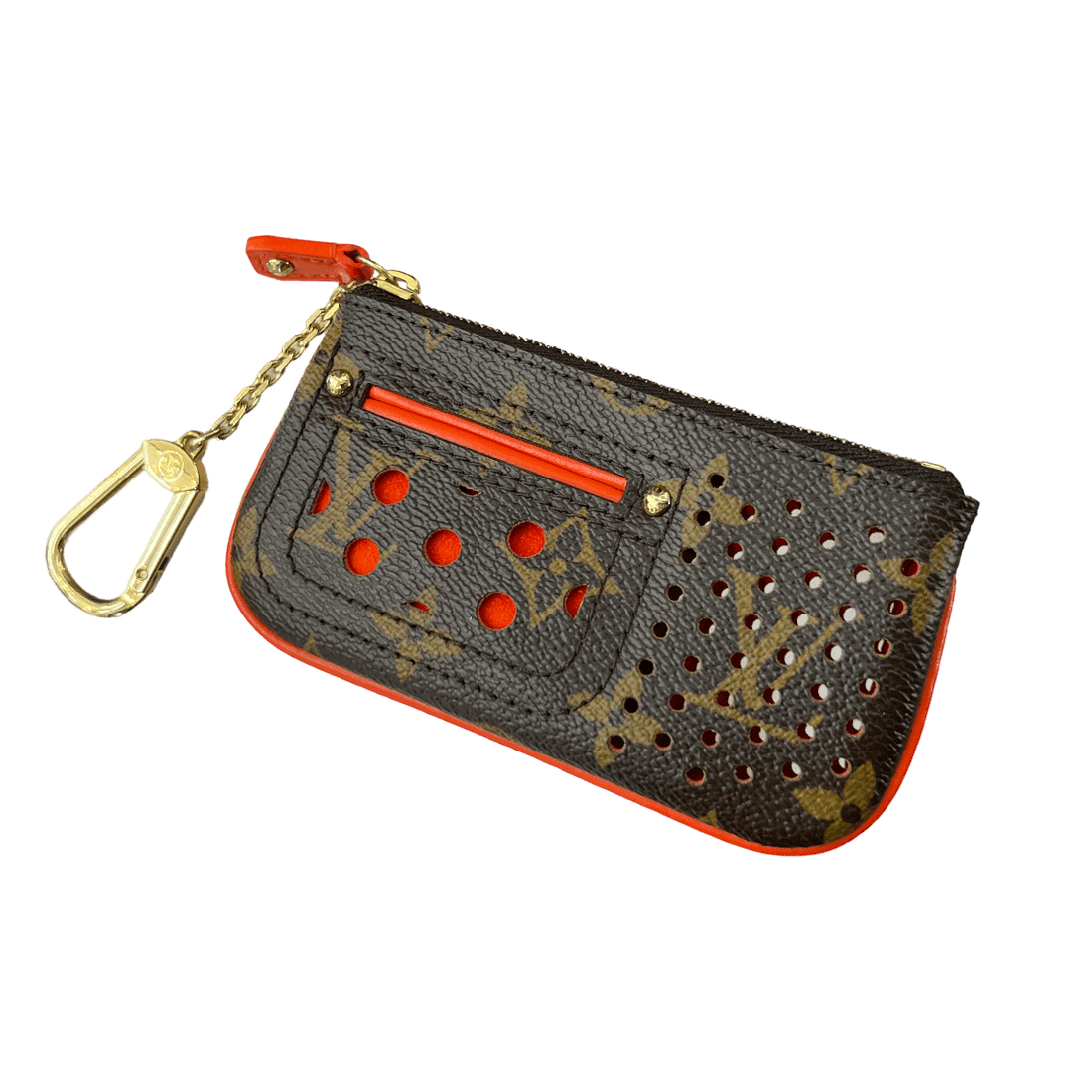 Close-up of a Louis Vuitton Perforated Key Pouch, featuring the iconic LV monogram pattern and perforated design. The pouch is made of Monogram Canvas and has a compact size suitable for holding keys or small essentials