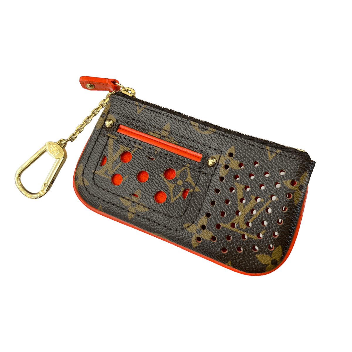 Close-up of a Louis Vuitton Perforated Key Pouch, featuring the iconic LV monogram pattern and perforated design. The pouch is made of Monogram Canvas and has a compact size suitable for holding keys or small essentials