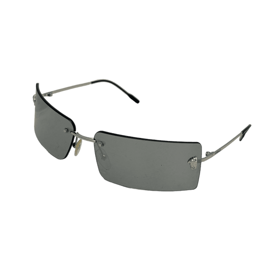 A pair of sleek Versace mirrored rimless sunglasses, featuring a reflective surface and minimalistic frame design, perfect for shielding eyes from the sun while exuding style and sophistication