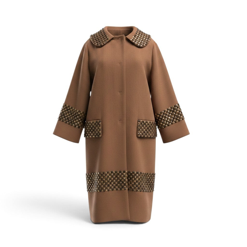 Pre-owned Dolce & Gabbana camel wool coat with crystal and pyramid stud embellishments on collar, cuffs and hem bands, size 38 — available at Style Reissue Vancouver