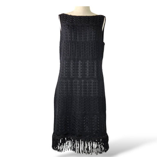 Pre-owned St. John Couture black open crochet knit sleeveless dress with fringe hem, size 12 — available at Style Reissue Vancouver