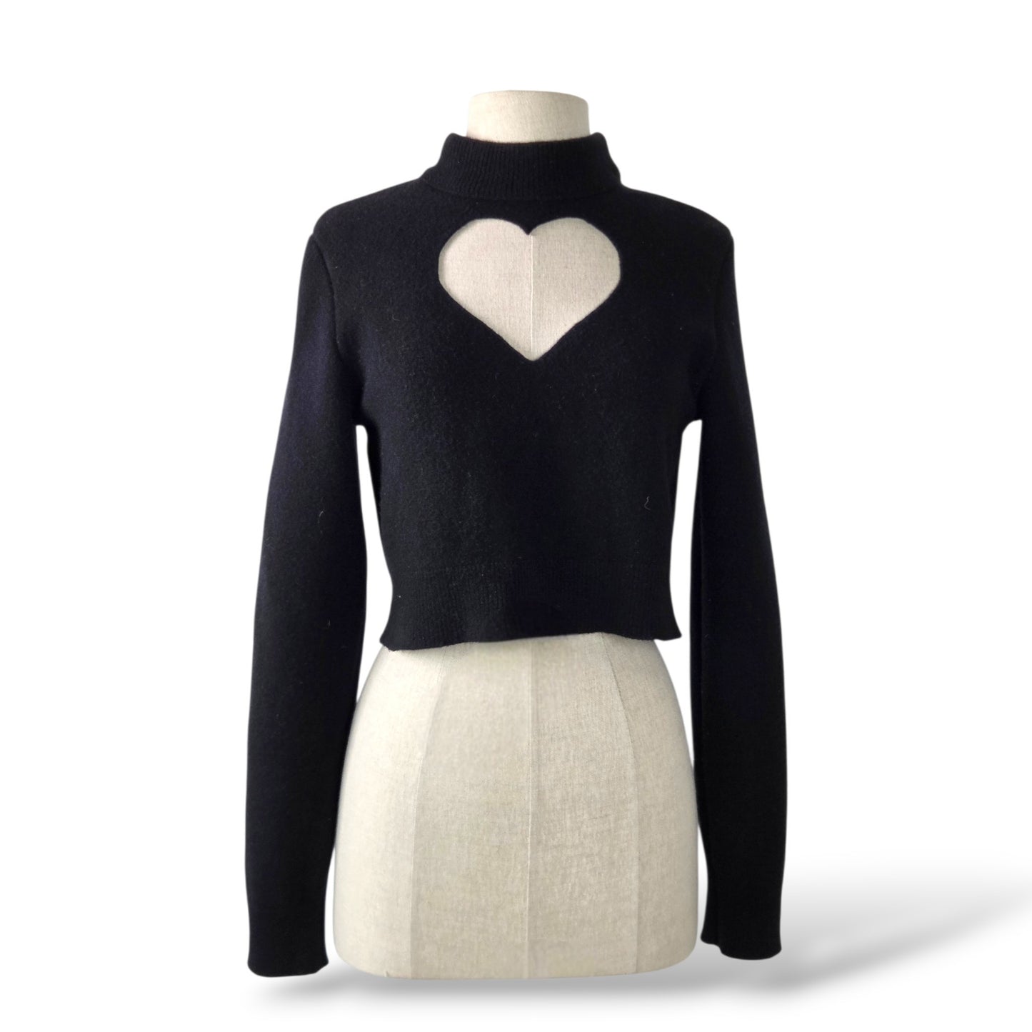 Pre-owned Alaïa black virgin wool cropped mock-neck sweater with heart cutout detail, size 36 — available at Style Reissue Vancouver