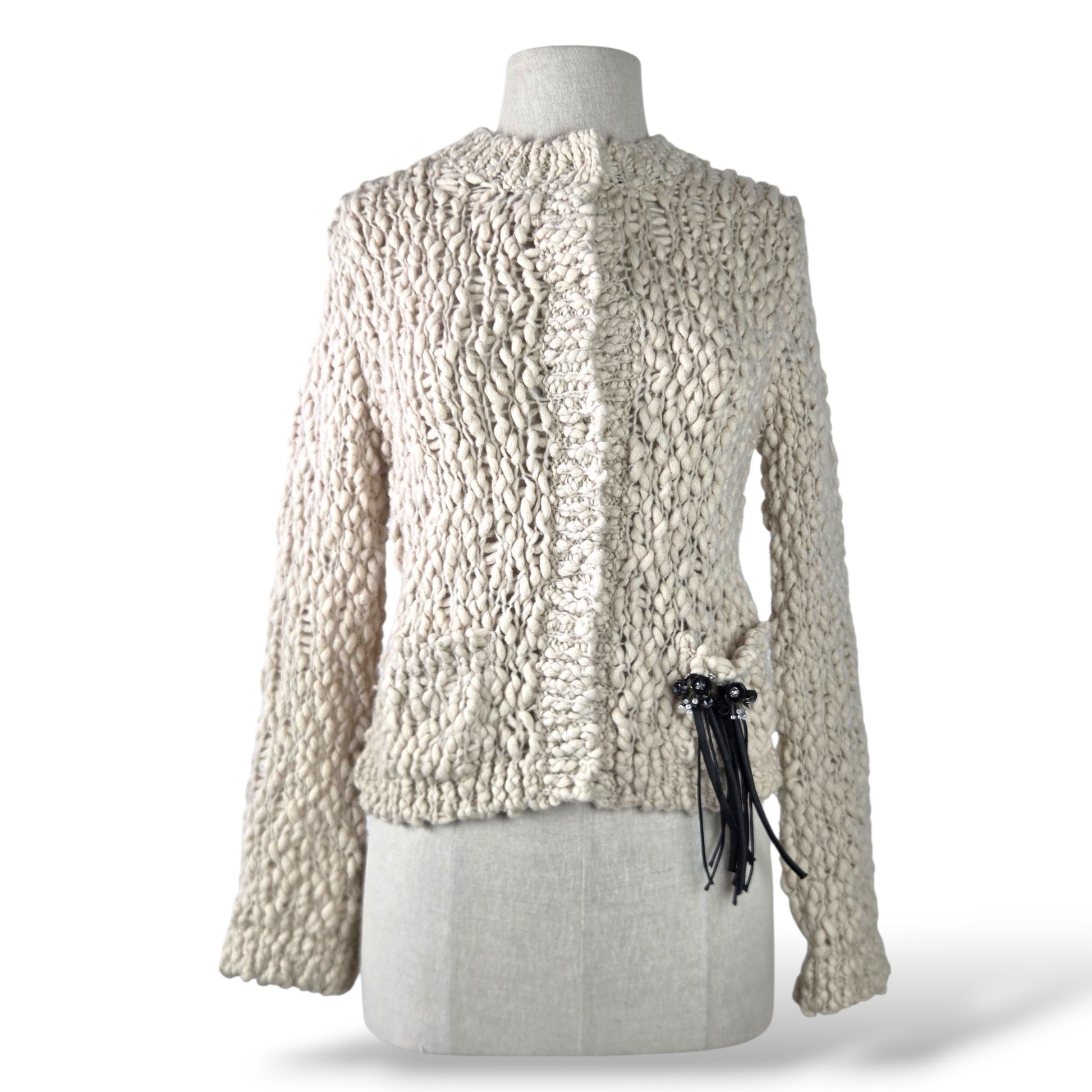 Pre-owned Dorothee Schumacher ivory chunky open-weave virgin wool cardigan with black tassel tie detail, size 1 — available at Style Reissue Vancouver