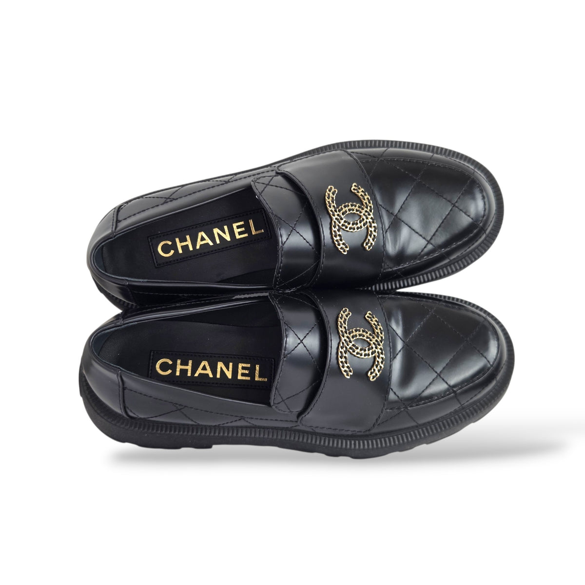 Pre-owned Chanel black quilted calfskin moccasin loafers with gold-tone CC logo detail
