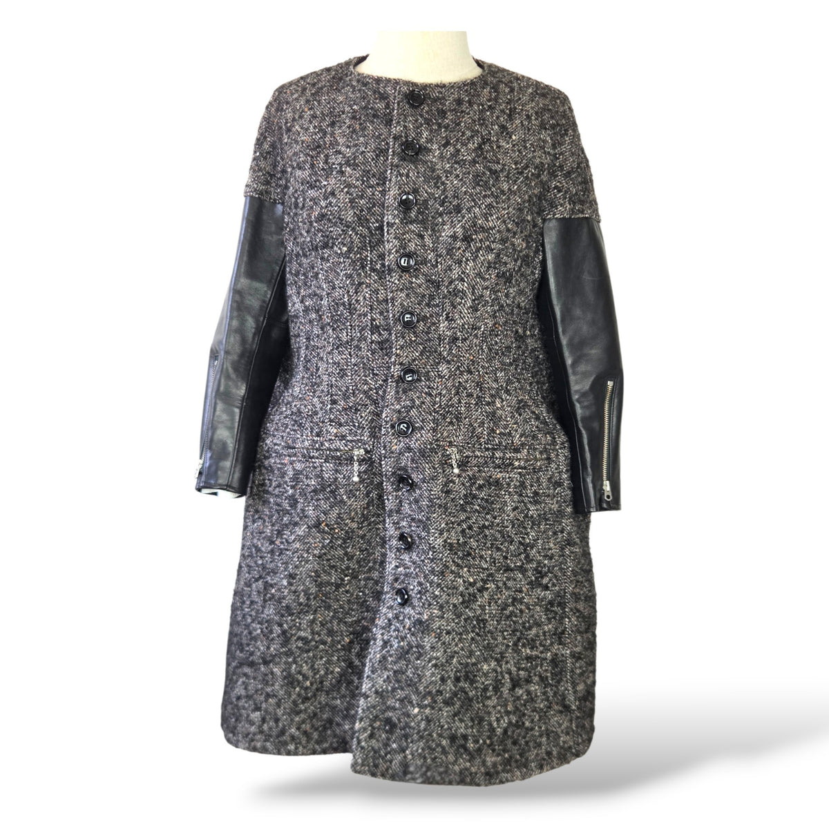 Pre-owned Junya Watanabe Comme des Garçons grey wool tweed collarless coat with black leather sleeves and zip pockets, size S — available at Style Reissue Vancouver
