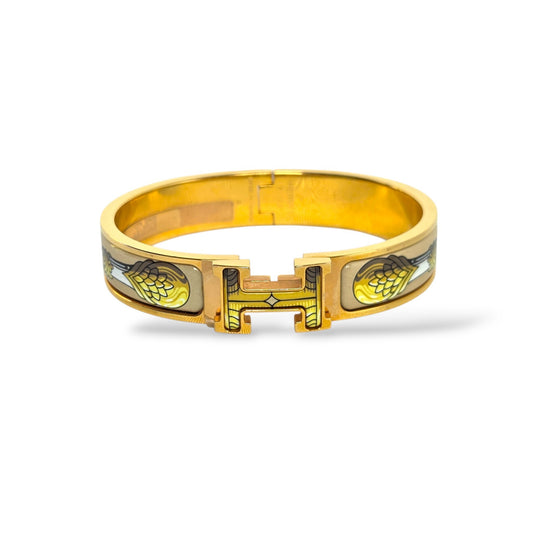 Pre-owned Hermès Clic Clac H PM printed enamel bracelet with Vliquetis Songe de Nuit patterned motif and polished yellow gold-plated H clasp

